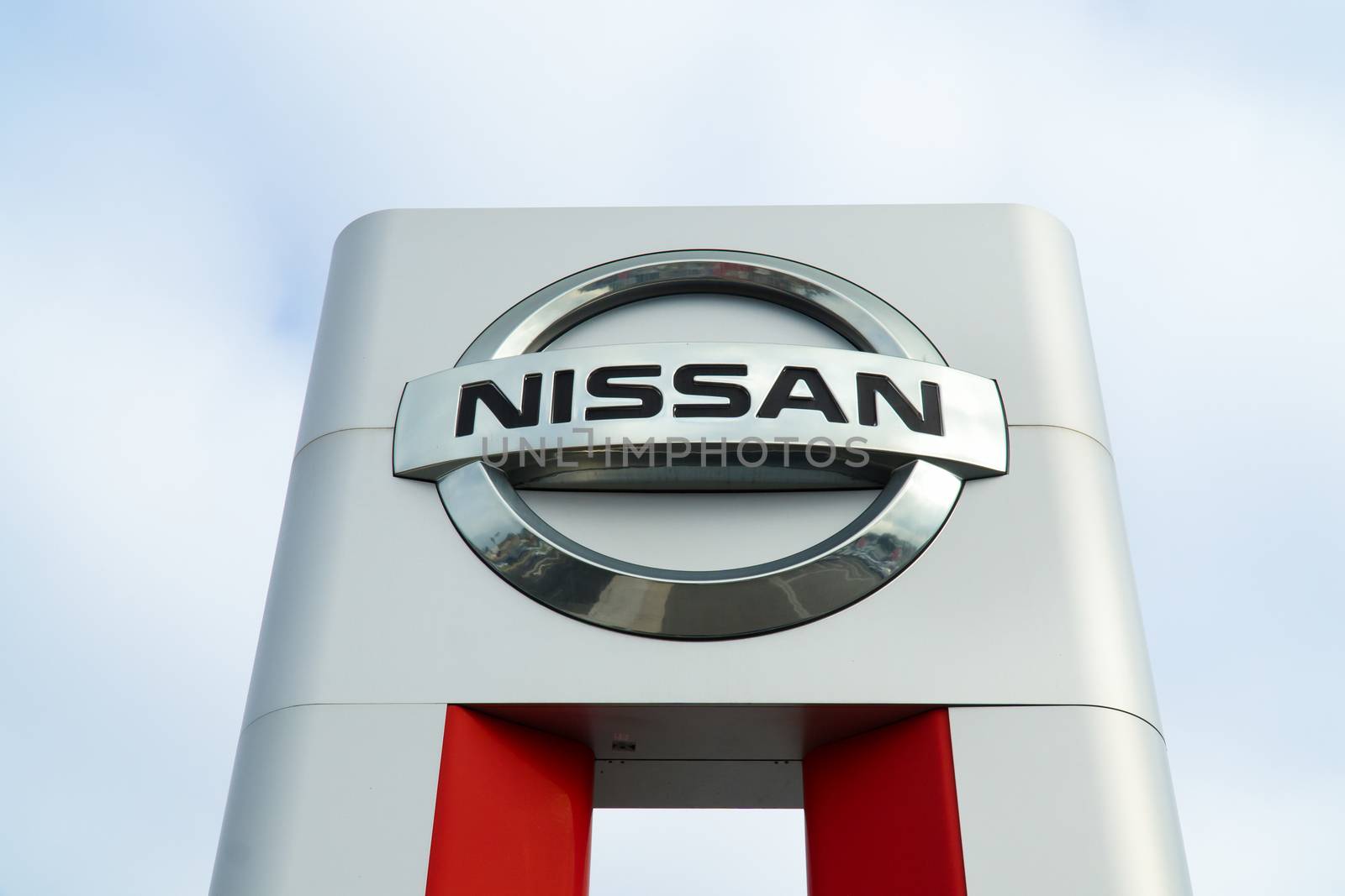 COSTA MESA, CA/USA - OCTOBER 17, 2015: Nissan Motors automobile dealership and sign.  Nissan Motors is is a Japanese multinational automotive manufacturer headquartered in Japan.