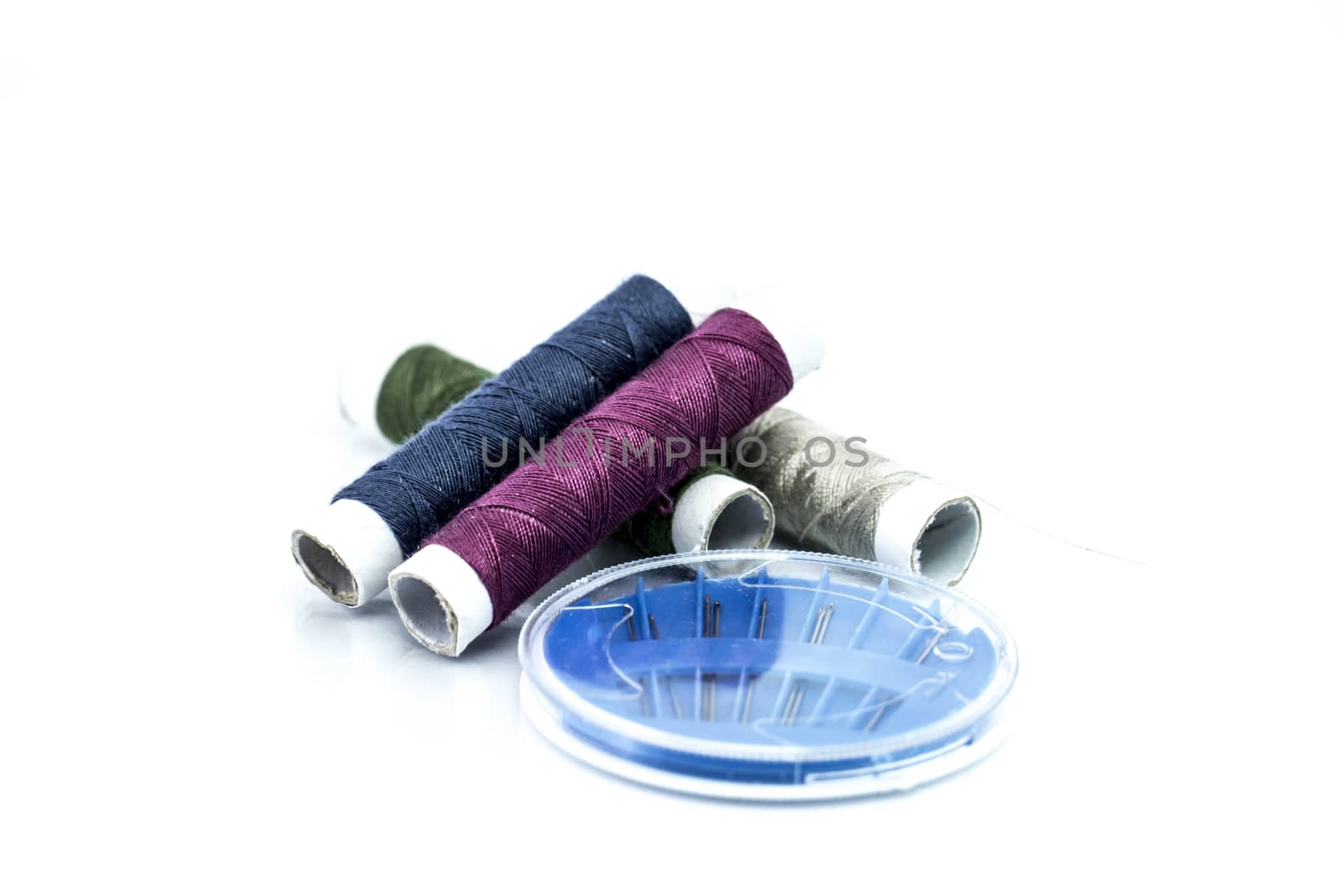 Yarn and sewing needles isolated on white background, embroidery designs