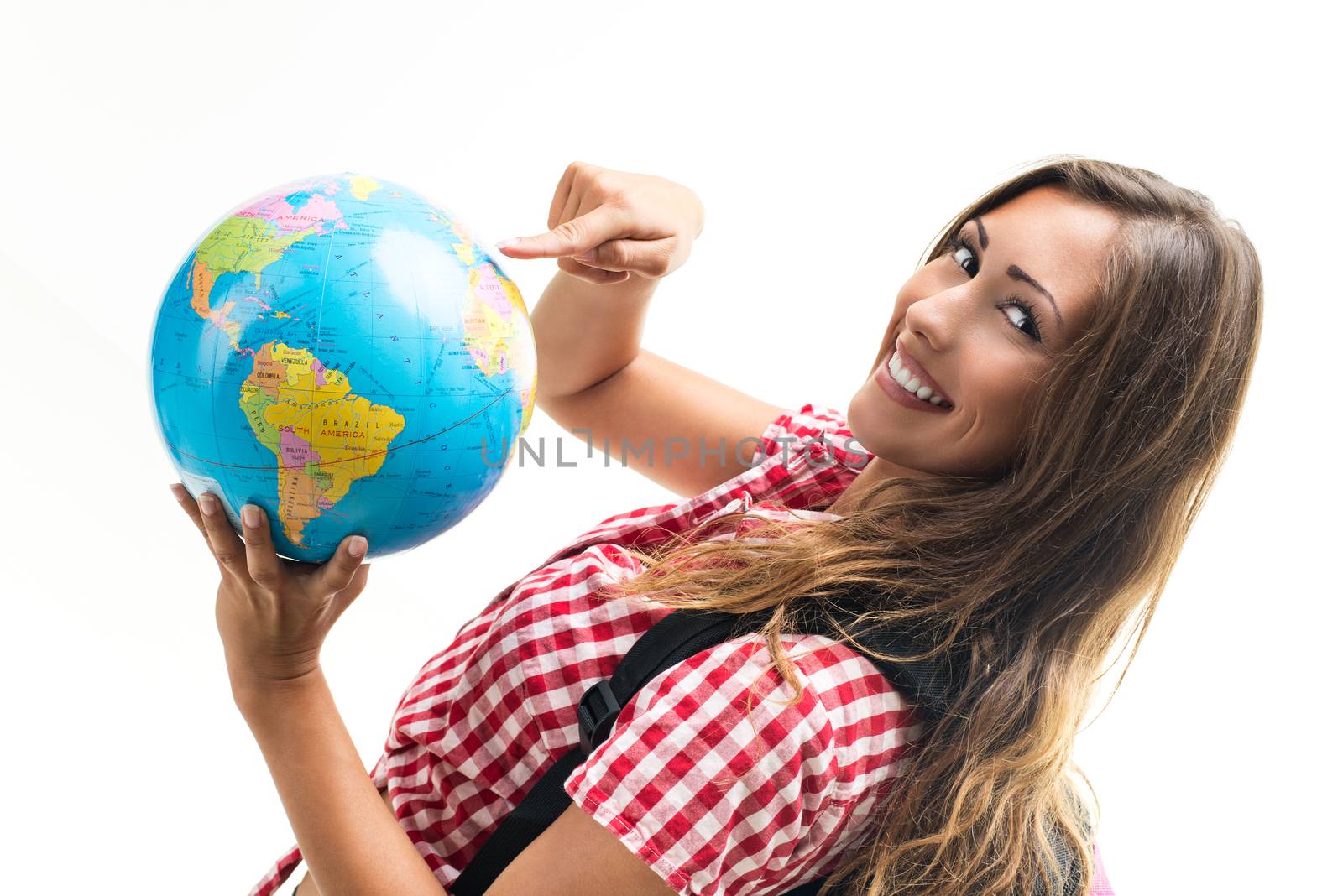 Beautiful young woman holding globe and looking at camera.