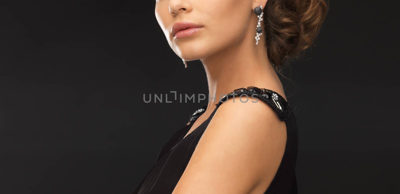 woman with diamond earrings by dolgachov