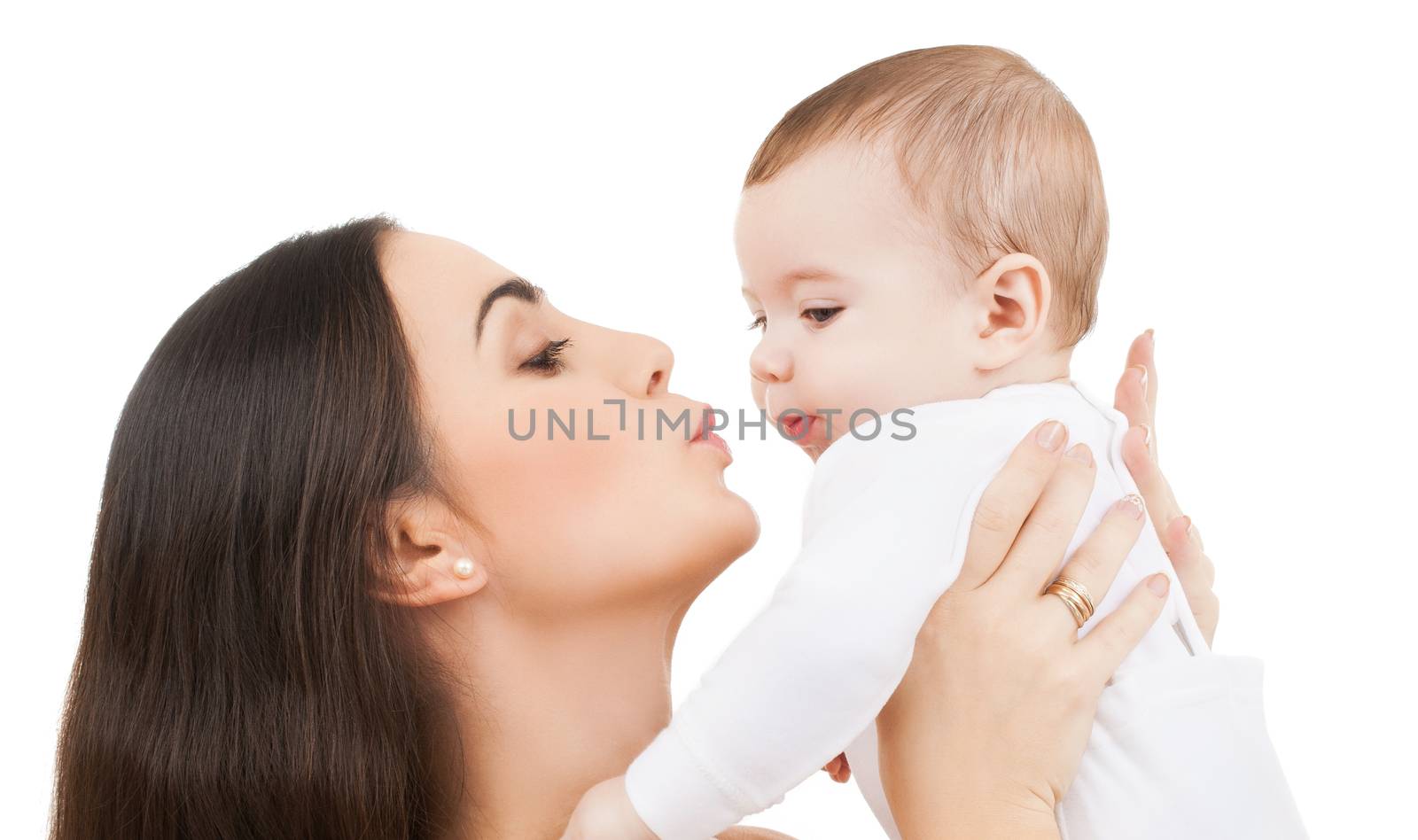 family and happy people concept - mother kissing her baby