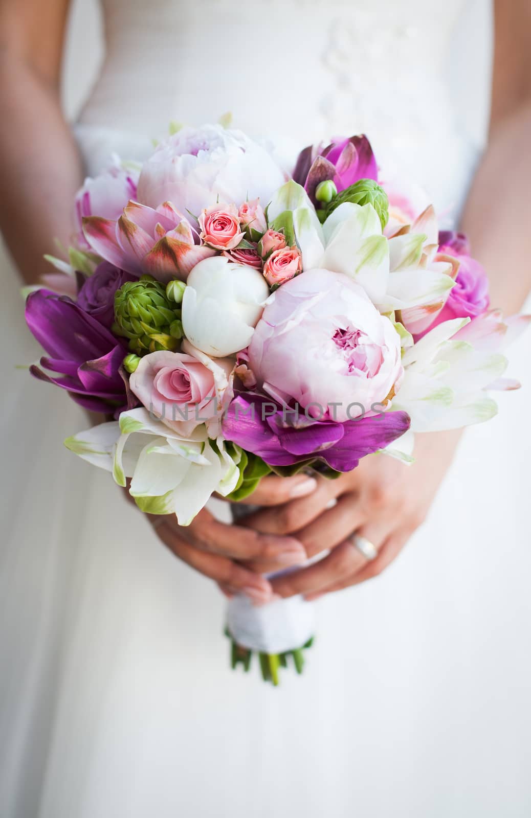 Beautiful wedding bouquet in hands of the bride by melis