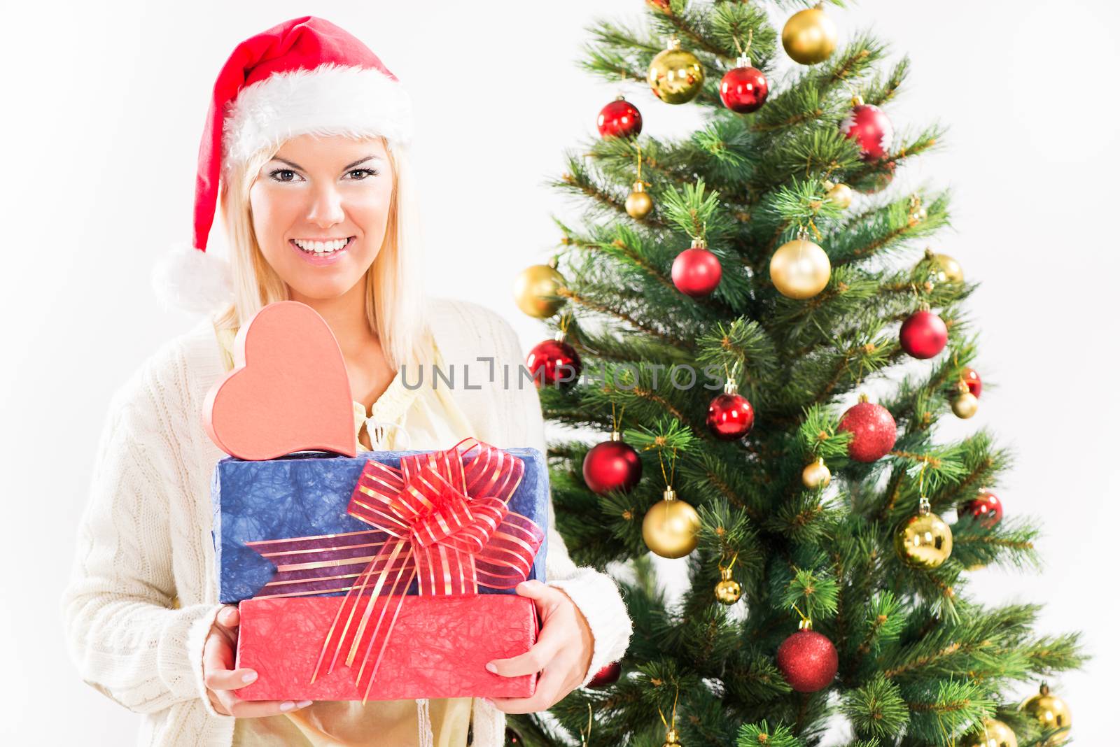 Beautiful happy christmas girl with christmas presents.