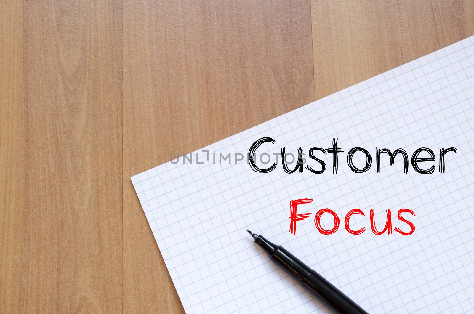 Customer focus text concept write on notebook