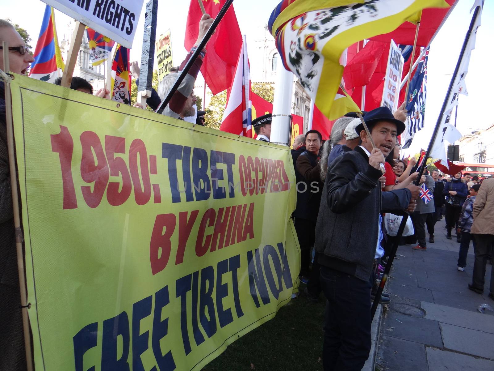 UK, London: Dozens of pro-Tibet protesters rally outside Parliament in London, England on October 20, 2015, as Chinese President Xi Jinping arrives for his address during his four-day visit. Since China's invasion of their country in 1950, Tibetans have never stopped resisting the occupation, and claiming the destruction of their way of life.