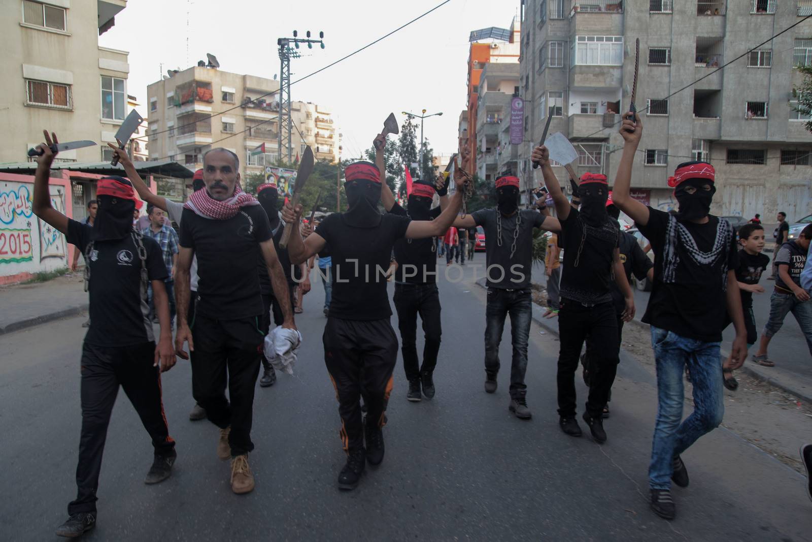 GAZA, Gaza City: Masked members of the Popular Front for the Liberation of Palestine hold weapons while participating in a protest in Gaza on October 20, 2015. The group is rallying against what it perceives to be Israeli aggression in Jerusalem, the occupied West Bank and Gaza region over the past month, during which an upsurge of violence, including stabbing and gun attacks, has led to the deaths of at least 37 Palestinians and seven Israelis. 