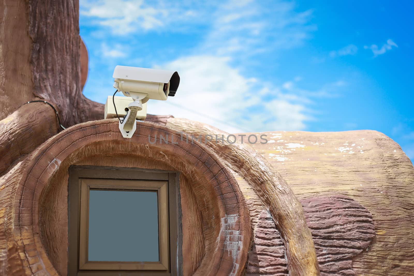 CCTV on window by powerbeephoto