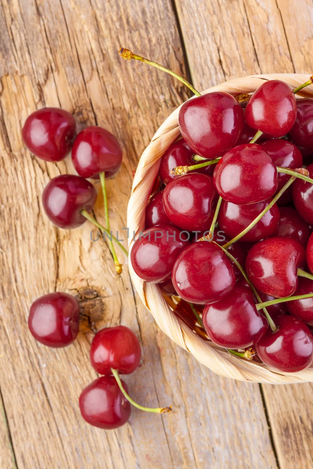 fresh cherries on wooden table