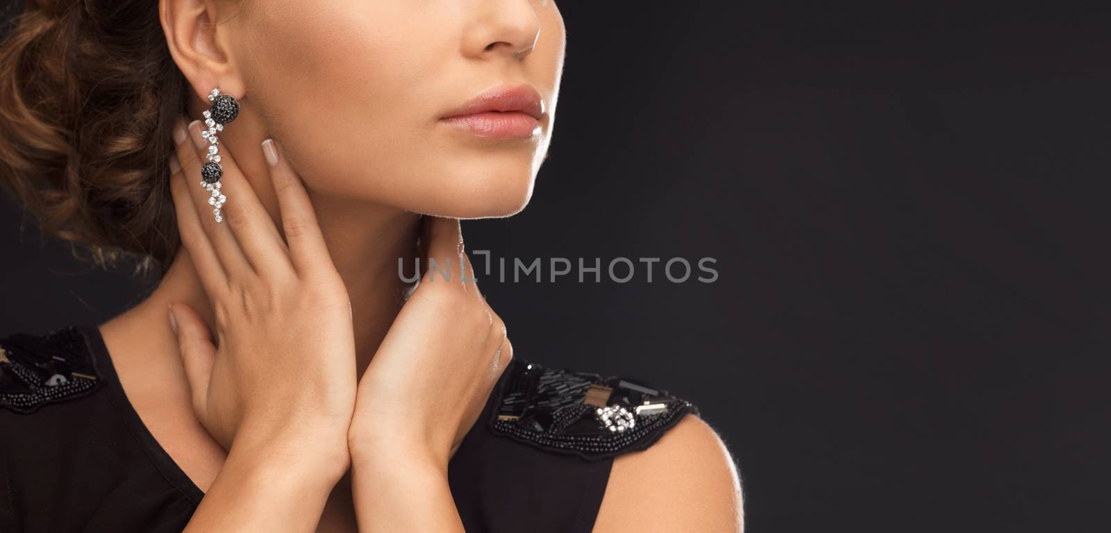 woman with diamond earrings by dolgachov
