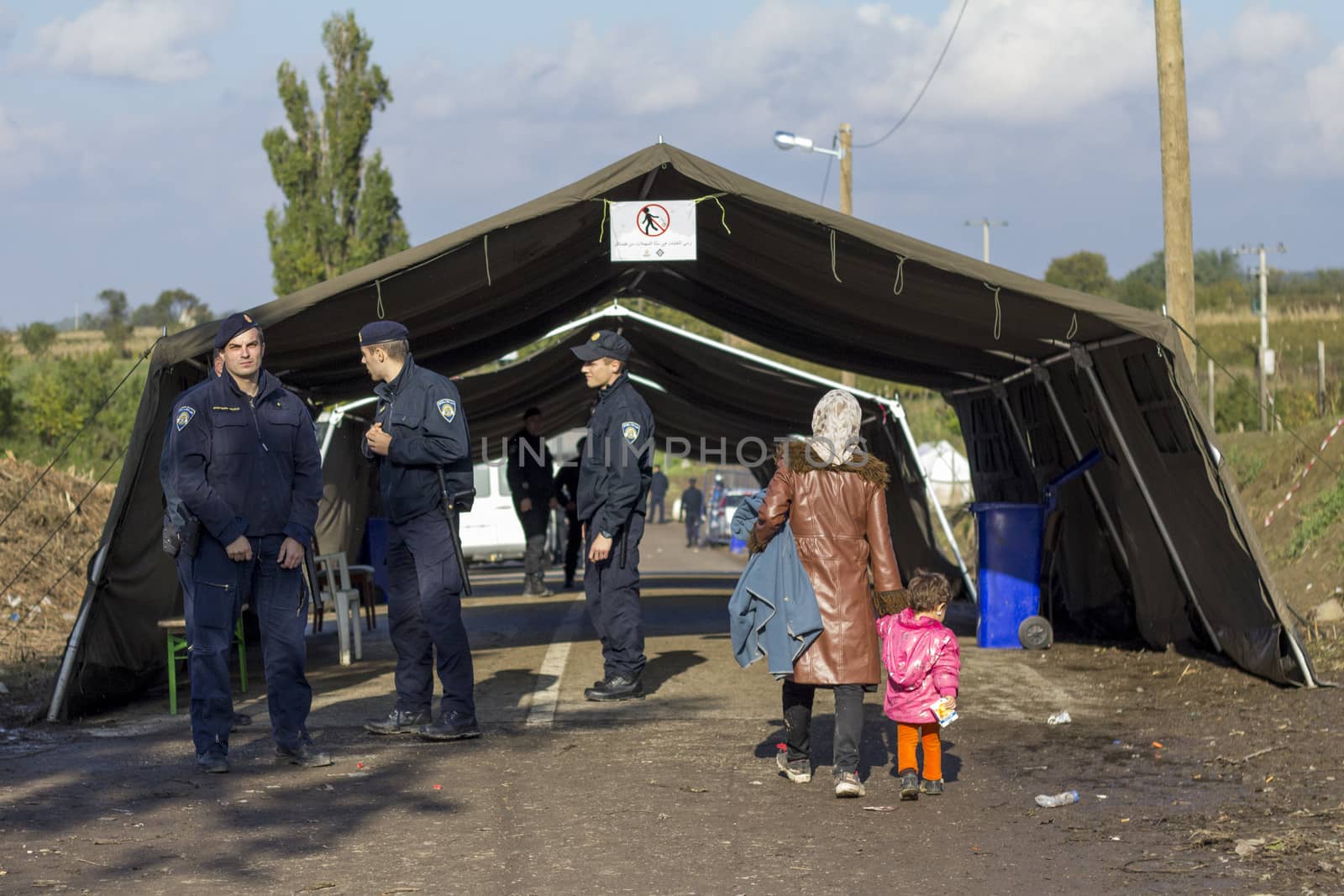 SERBIA, Berkasovo: Refugees are pictured in Berkasovo, Serbia, at the border with Croatia, waiting for passing to Bapska, Croatia, on October 17, 2015. In the following days, Austrian, Slovenian and Croatian authorities decided to limit the refugees' passage, causing a 	bottleneck in Berkasovo.