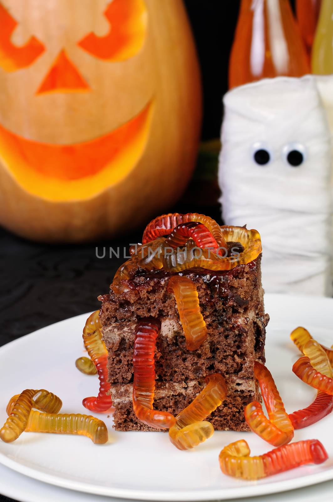piece of chocolate cake with jelly worms
