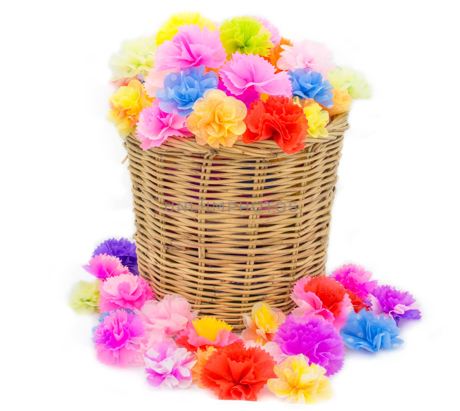 Bright flowers in basket isolated on white