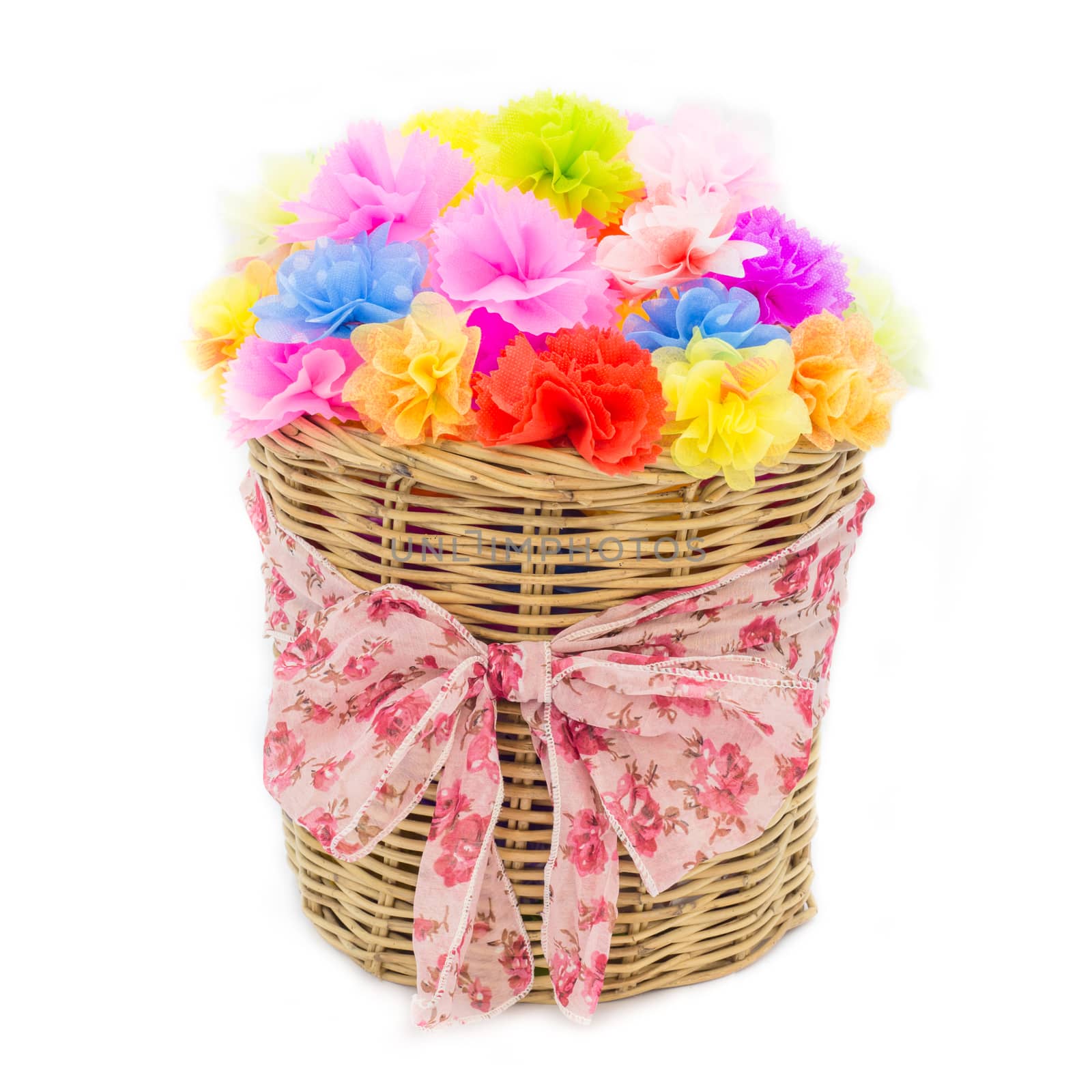 Bright flowers in basket isolated on white by powerbeephoto