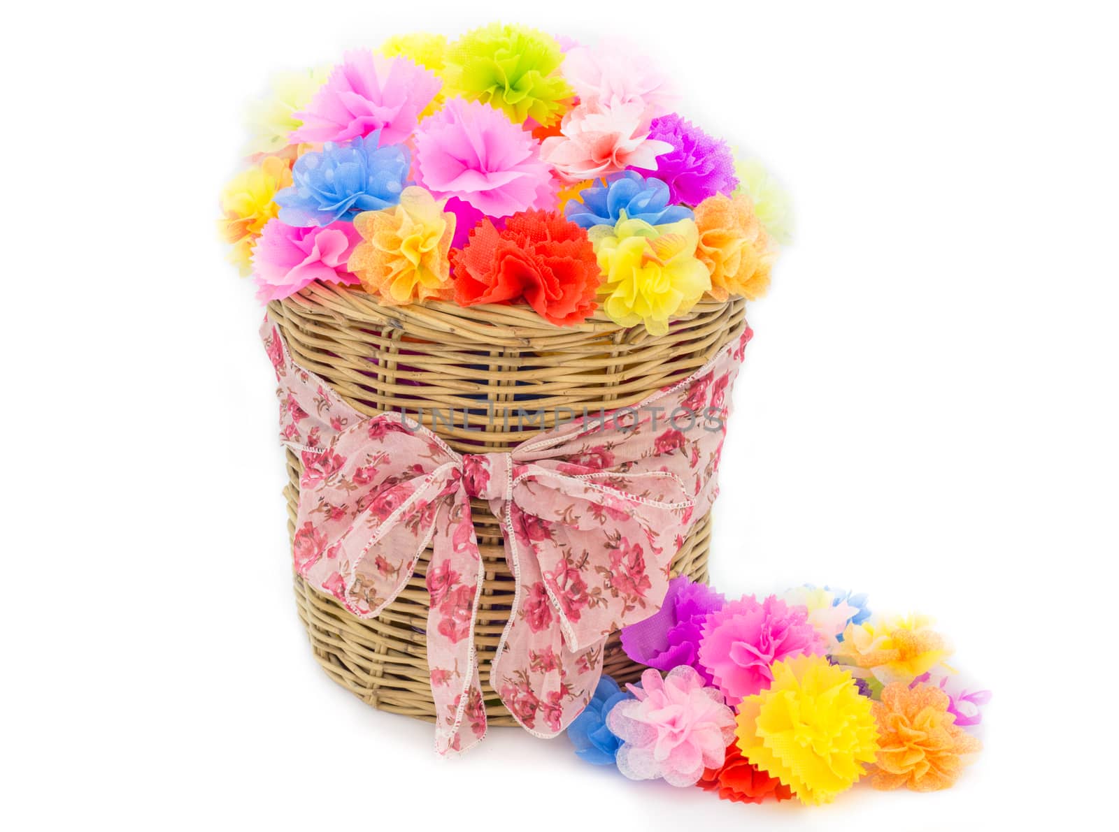 Bright flowers in basket isolated on white by powerbeephoto