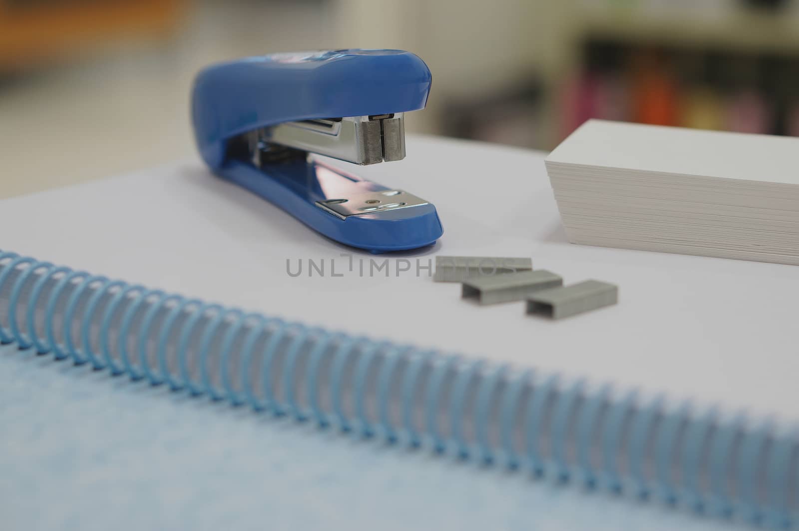 Blue stapler and staples by ninun