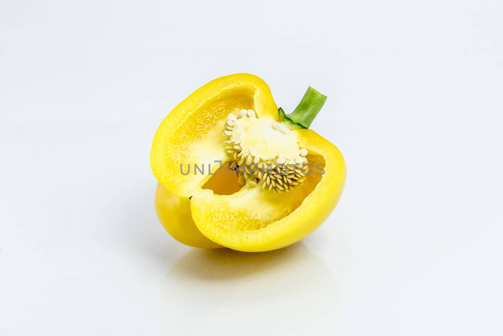 yellow pepper isolated on white background by teerawit
