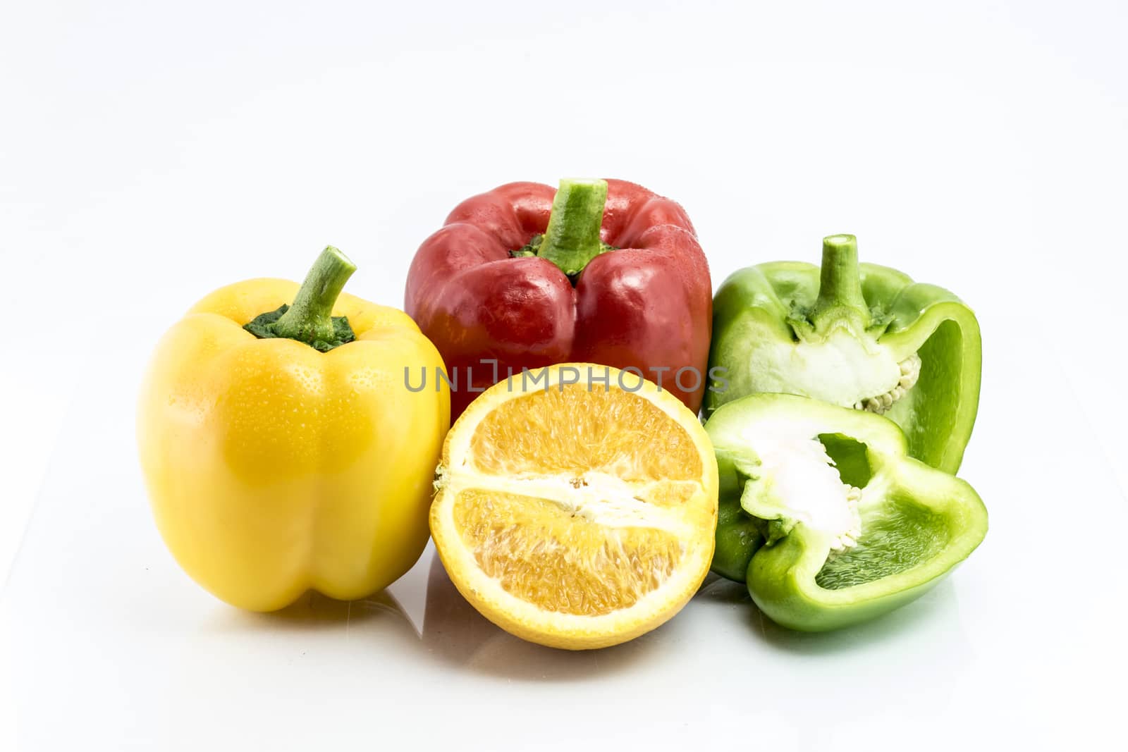 pepper and Orange isolated on white background by teerawit