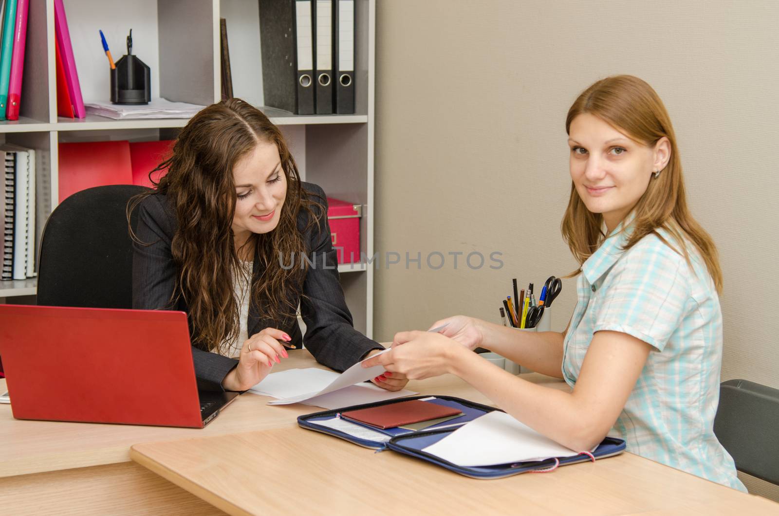 Young beautiful girl on reception at the office specialist