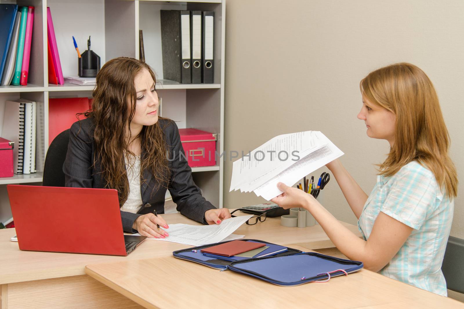 Young beautiful girl on reception at the office specialist