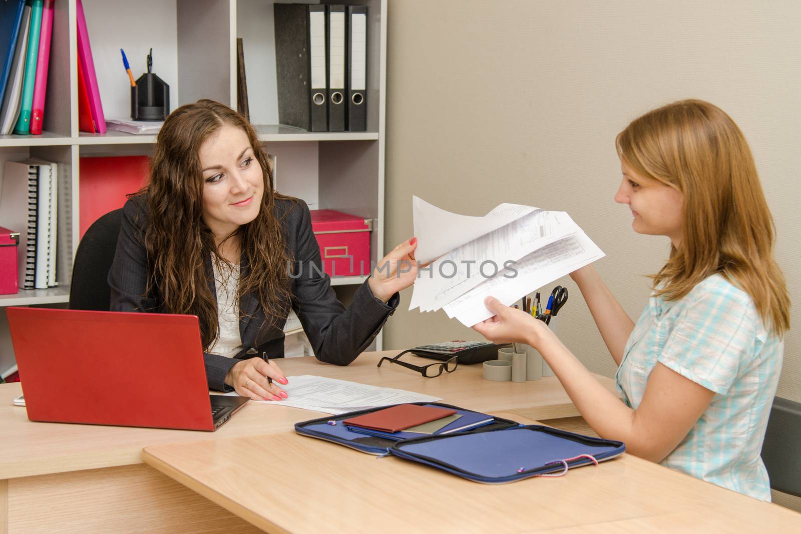 Young beautiful girl on reception at the office specialist