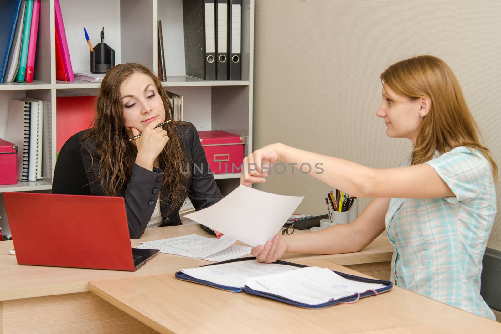 Young beautiful girl on reception at the office specialist