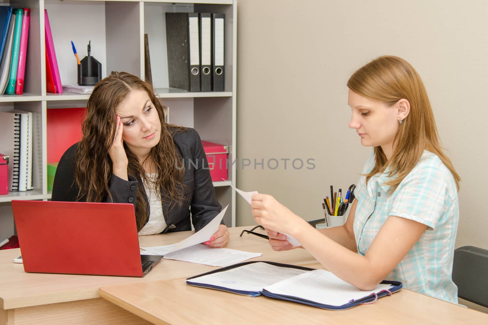 Young beautiful girl on reception at the office specialist