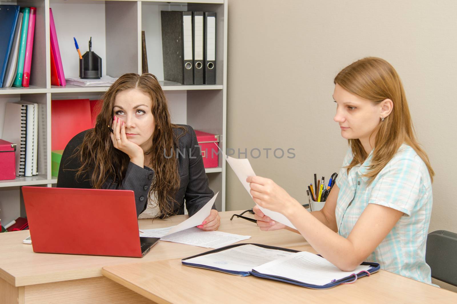Young beautiful girl on reception at the office specialist