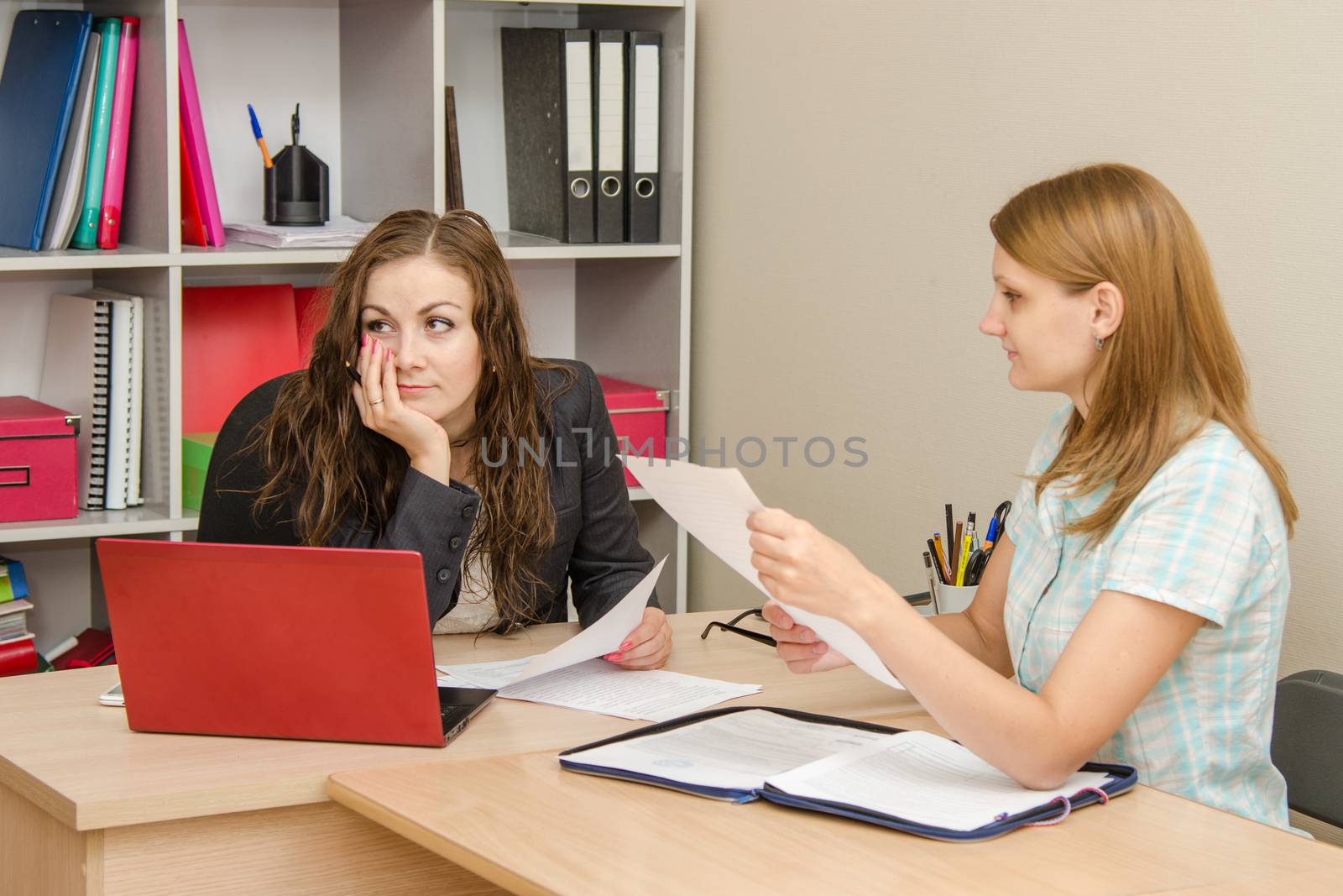 Young beautiful girl on reception at the office specialist