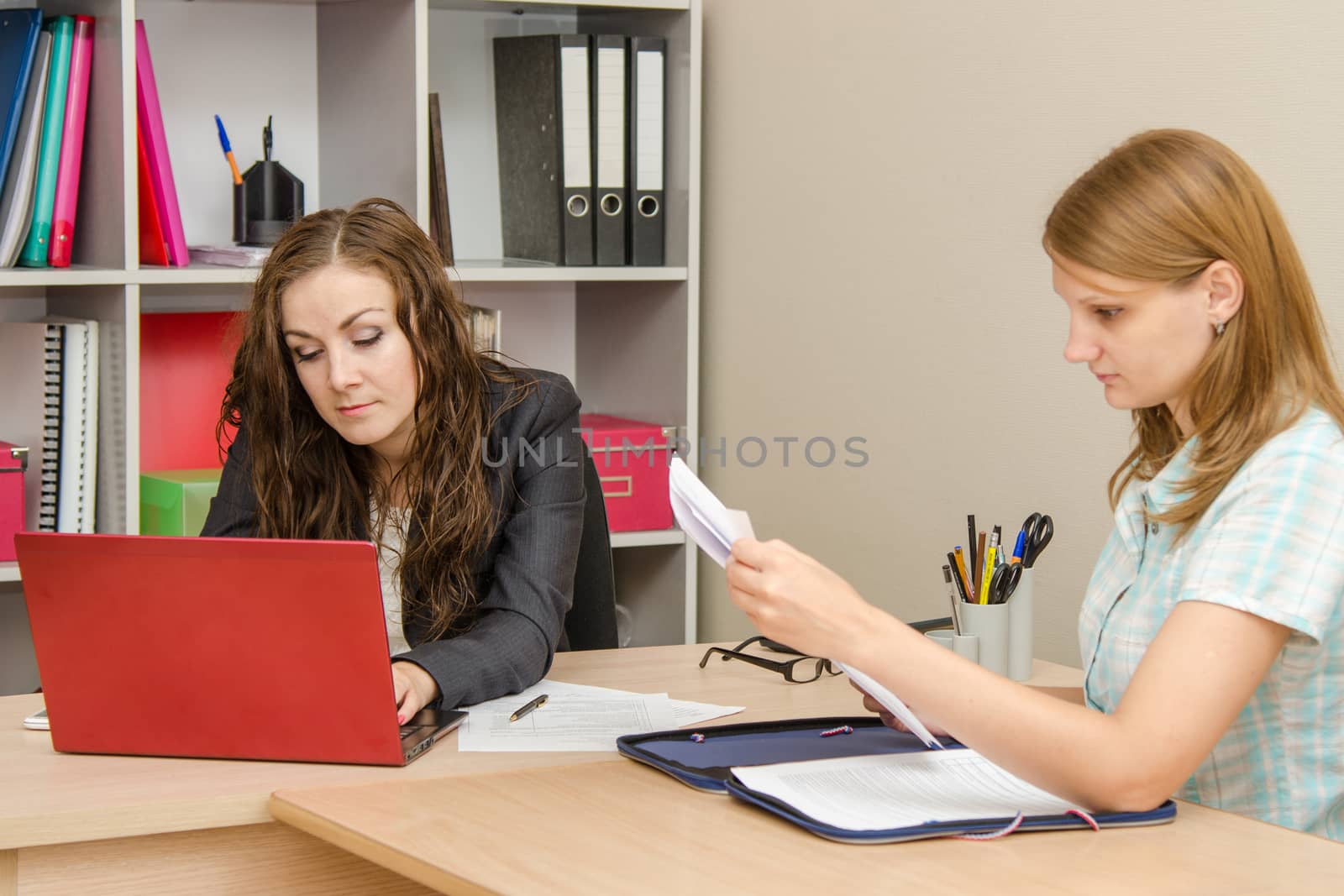 Young beautiful girl on reception at the office specialist