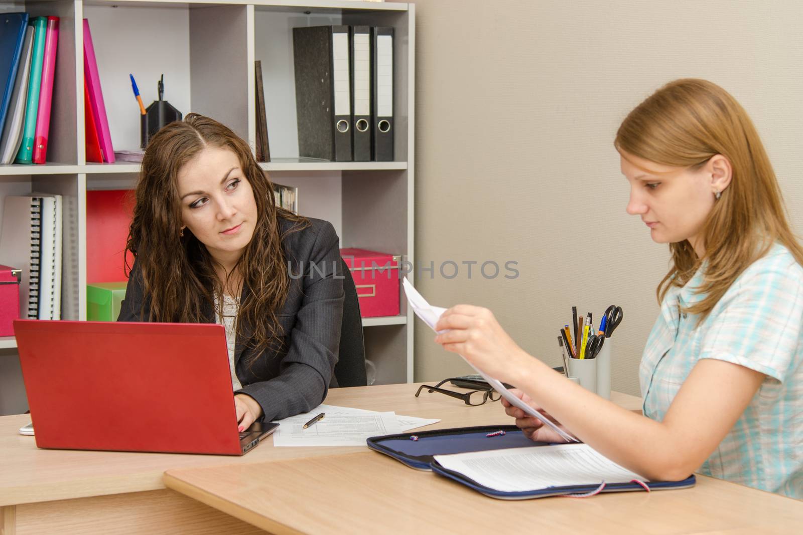 Young beautiful girl on reception at the office specialist
