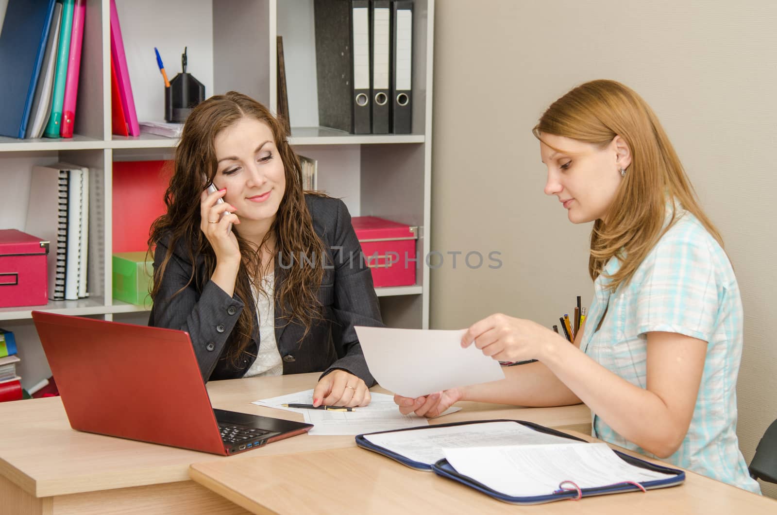 Young beautiful girl on reception at the office specialist