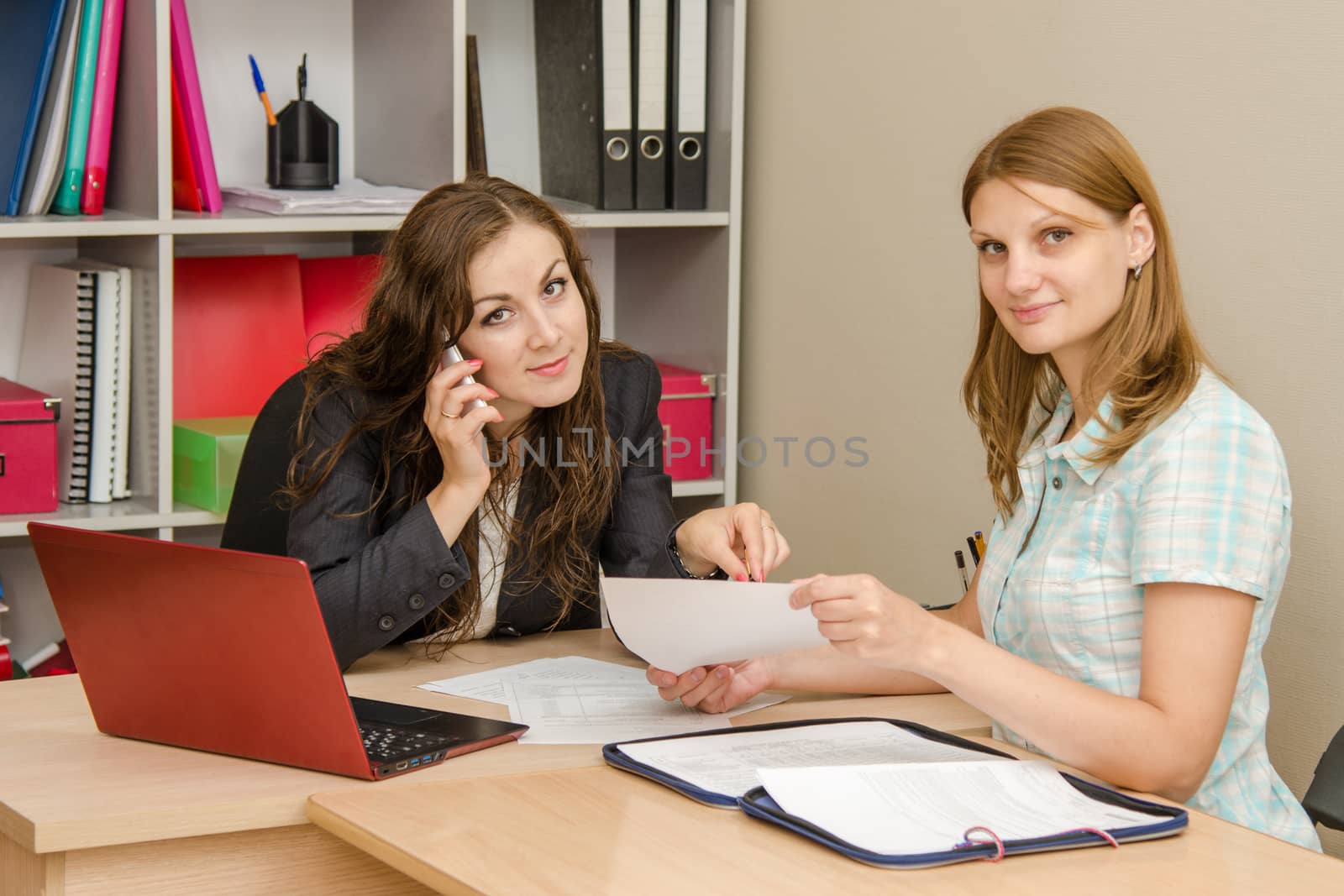 Young beautiful girl on reception at the office specialist