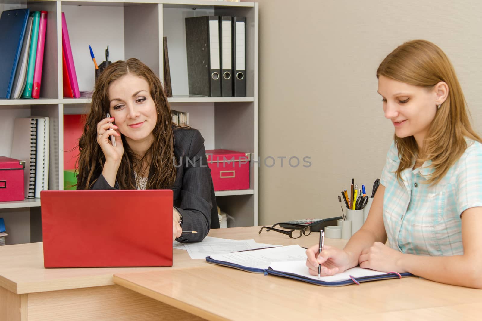 Young beautiful girl on reception at the office specialist