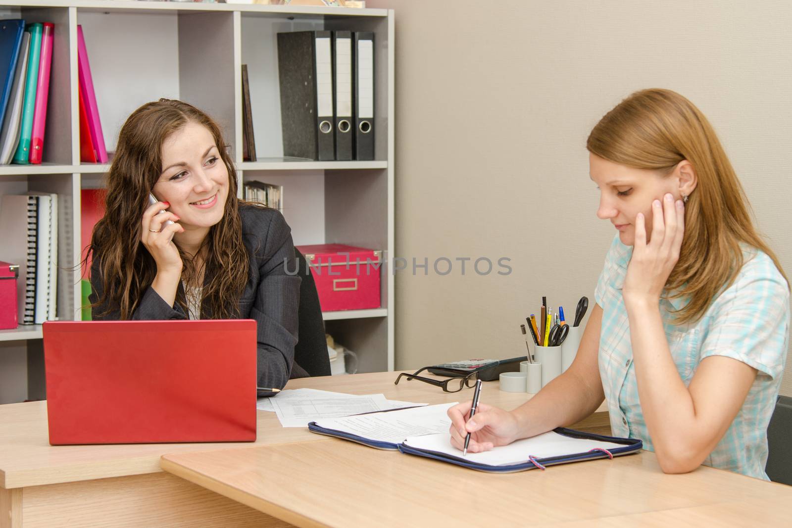 Young beautiful girl on reception at the office specialist