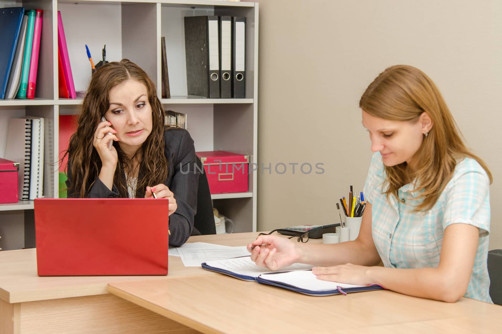 Young beautiful girl on reception at the office specialist