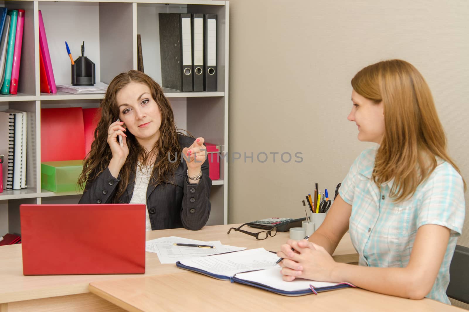 Young beautiful girl on reception at the office specialist