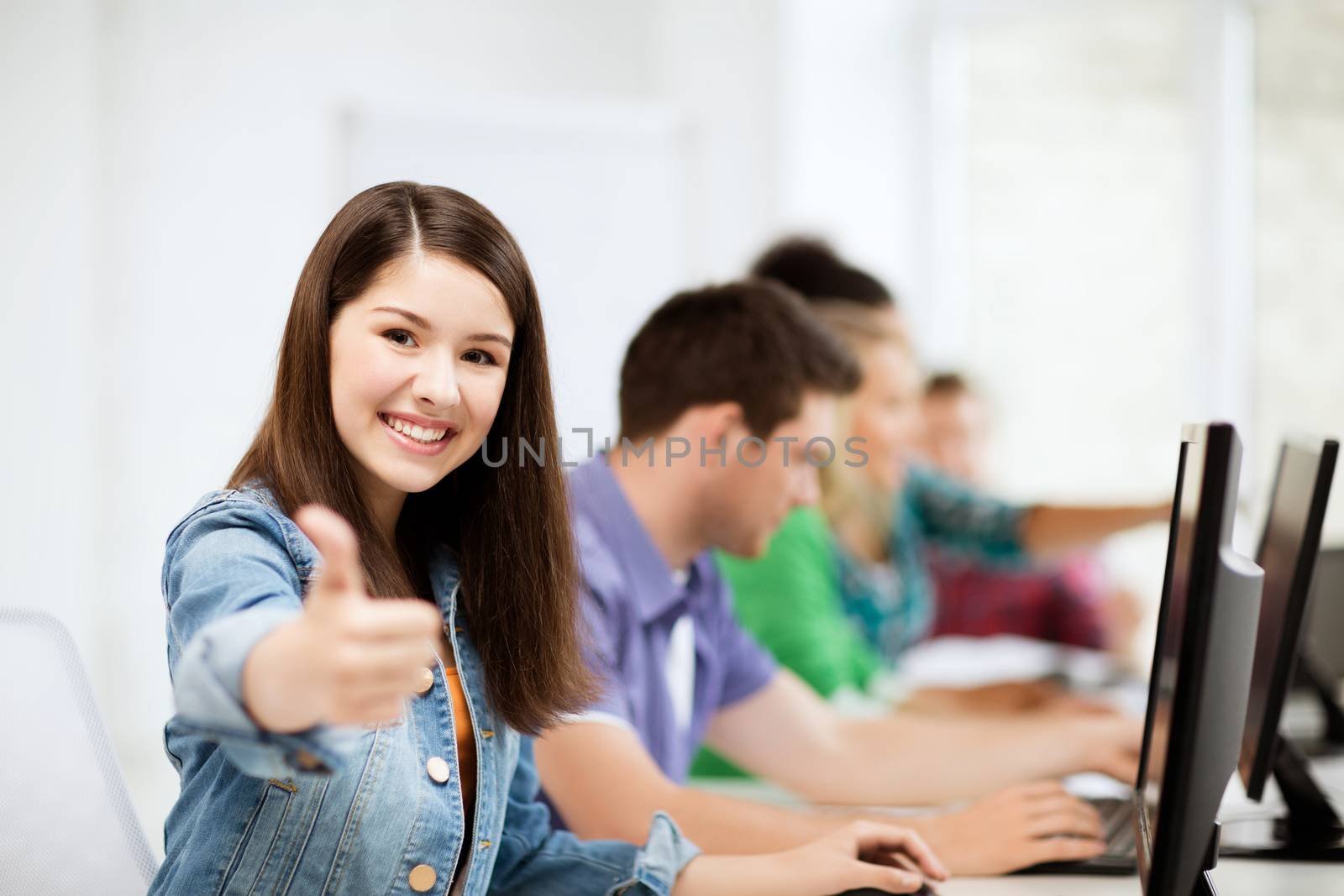 education, technology and internet - student with computers studying at school