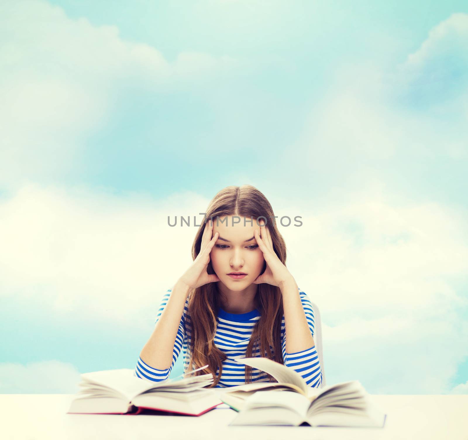 education and home concept - stressed student girl with books