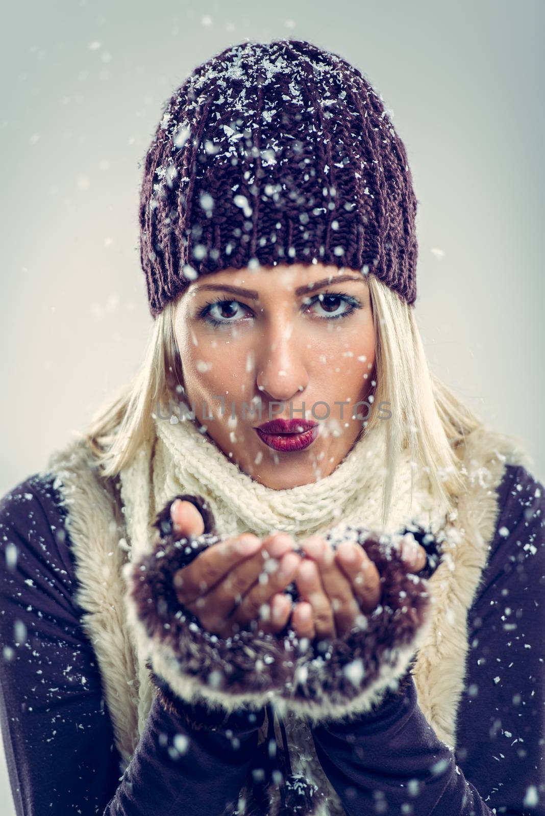 Cute Girl Blowing Snowflakes by MilanMarkovic78