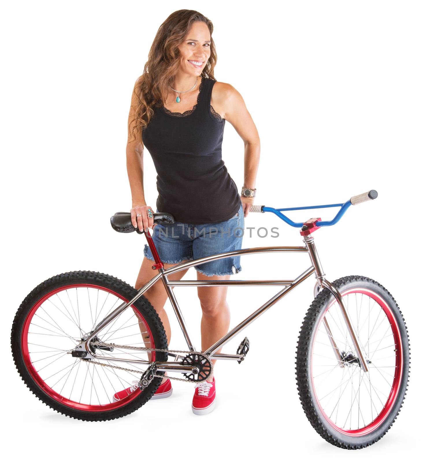 Cute adult female in shorts with bike