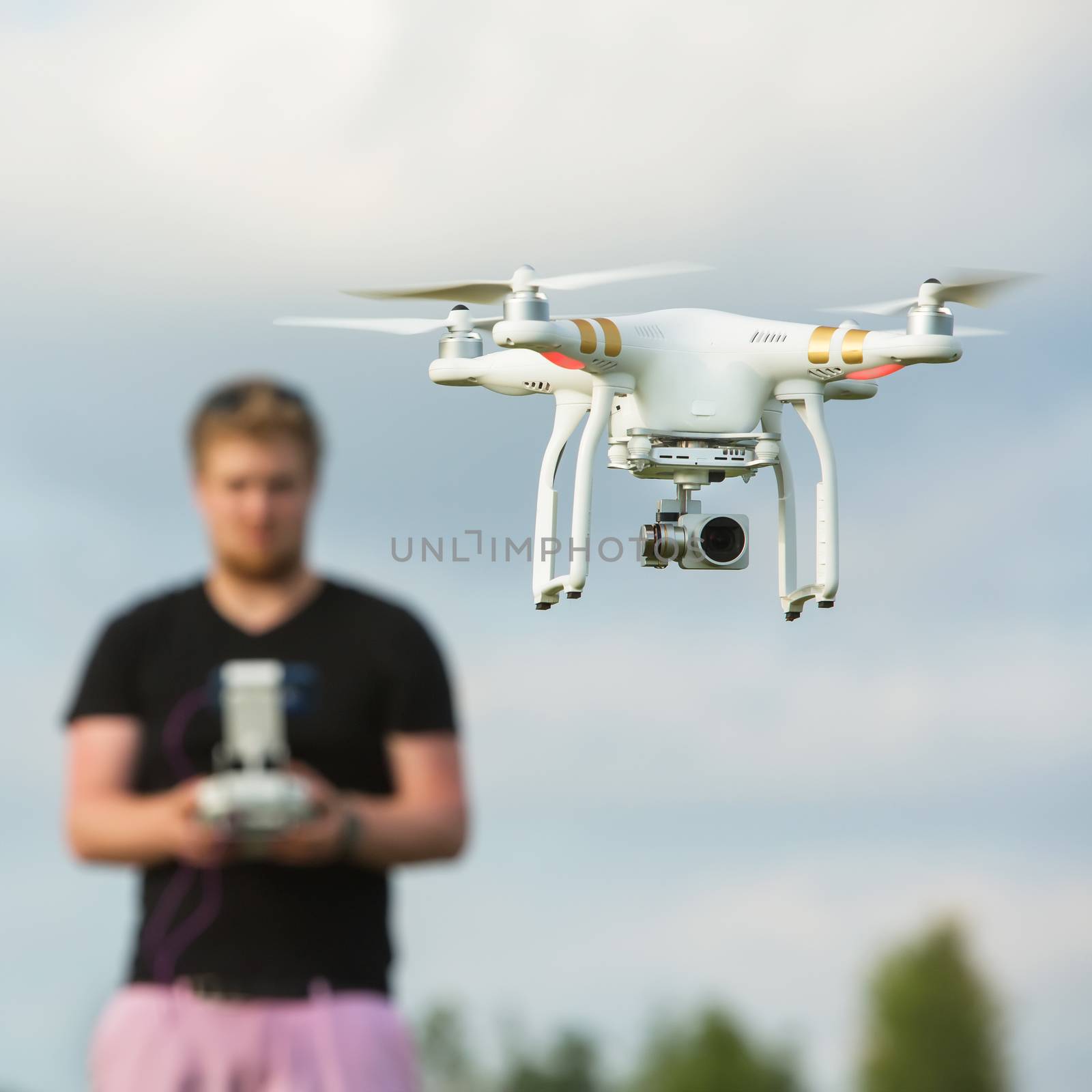 Person Flying a Camera Drone by Creatista
