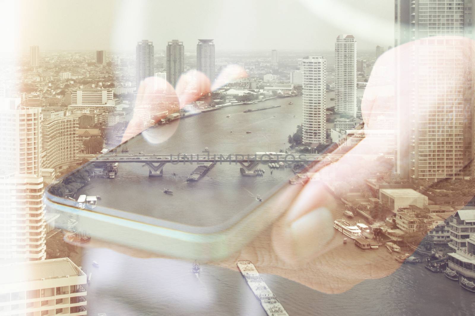 Double exposure image of people with smart phone and cityscape background.