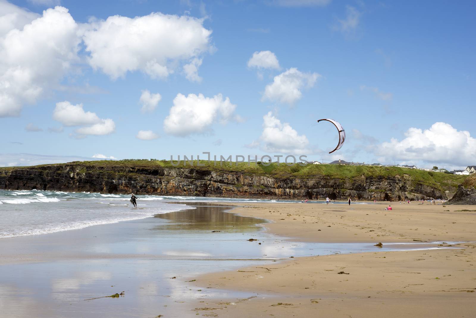 lone kite surfer getting ready at ballybunion beach on the wild atlantic way