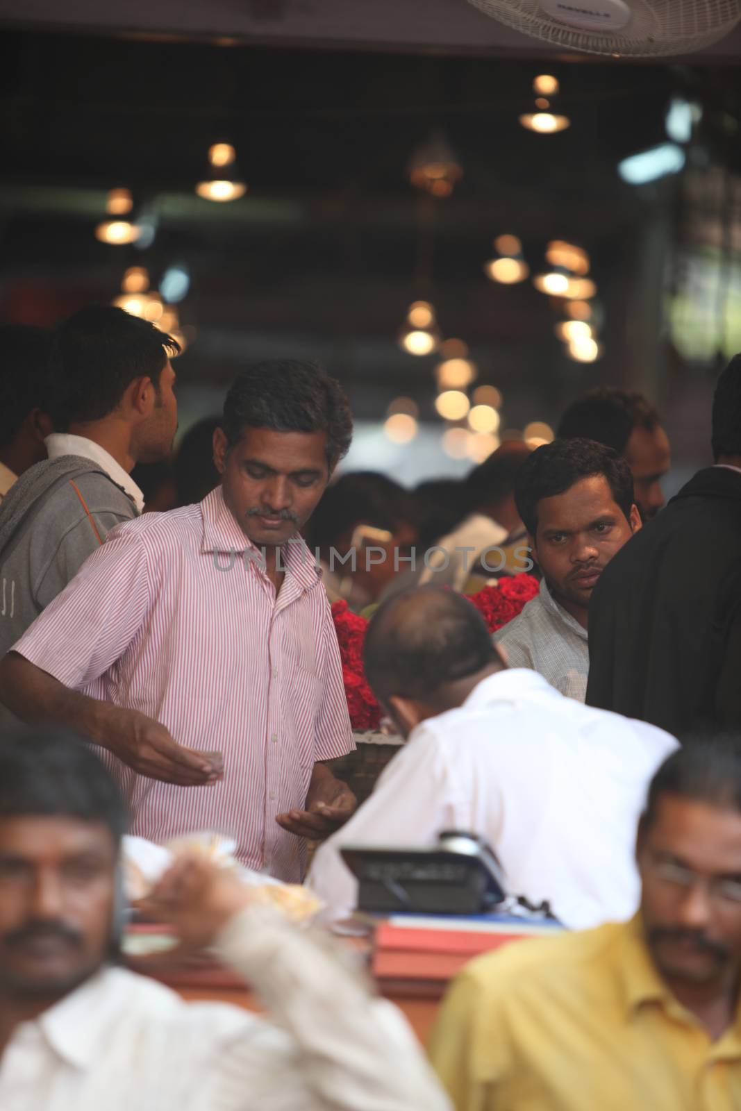 Pune, India - October 21, 2015: People crowded at a flower market during Indian festival Dassera.