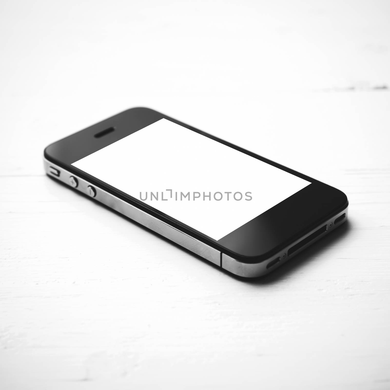 cellphone over white table black and white color style