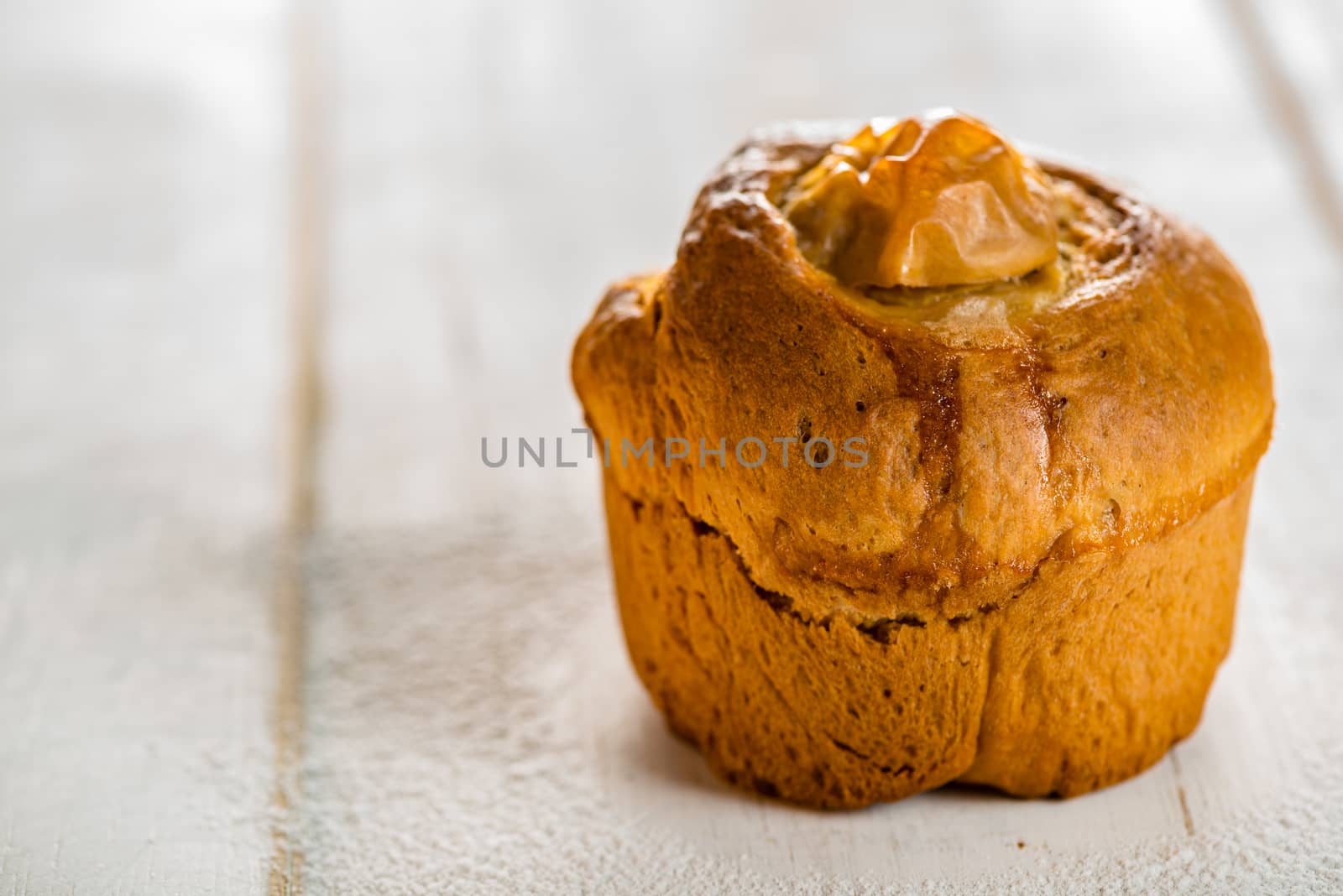 Small apple cake on white wood table