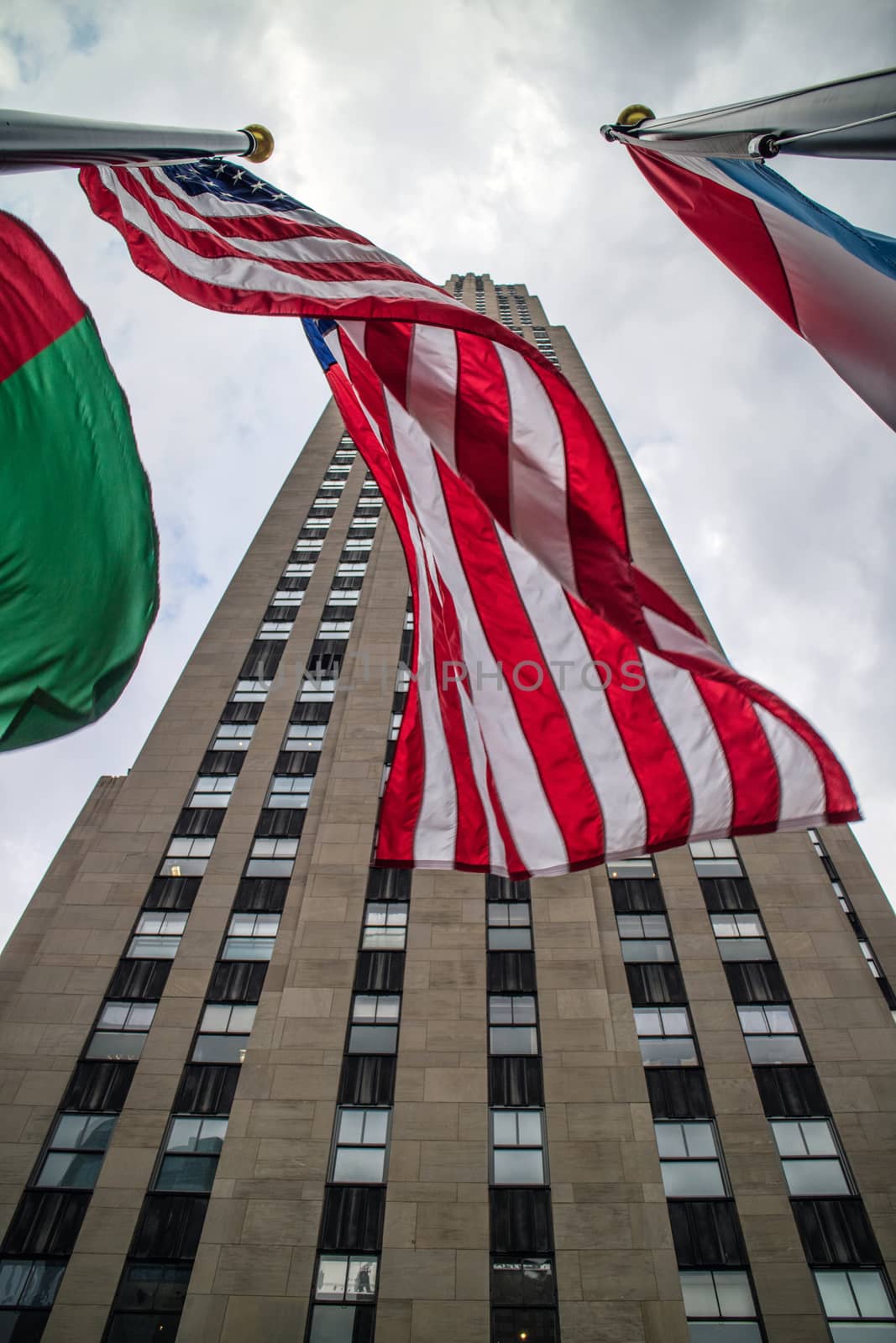 Rockfeller Center Building Perspective with flags Manhattan