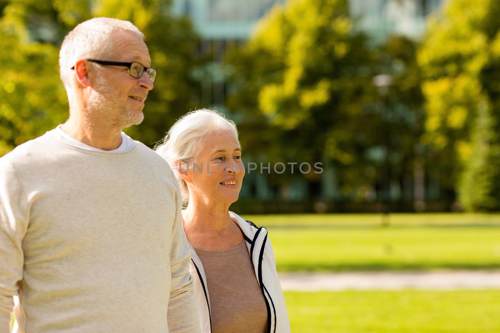 senior couple in city park by dolgachov