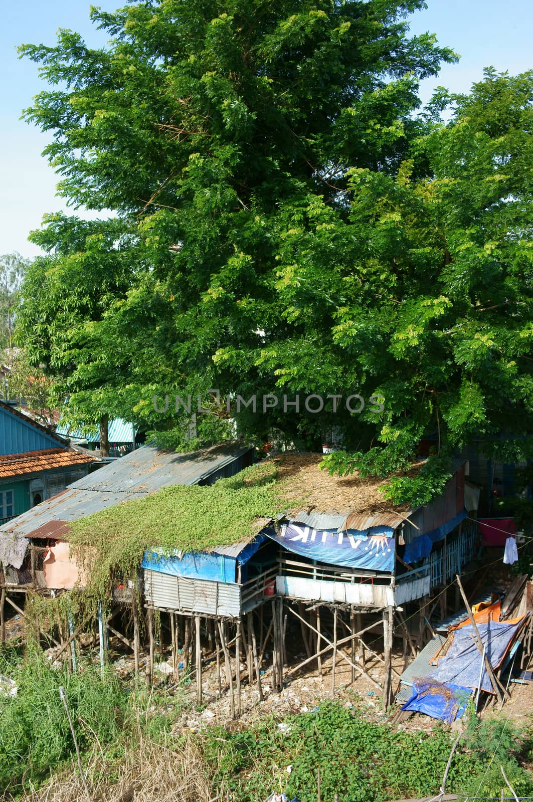HONG NGU- VIET NAM- OCT 15: Residential on water, group of floating house of poor people on Mekong Delta river, precarious life, danger, home from sheet metal, Hongngu, Vietnam, Oct 15, 2015