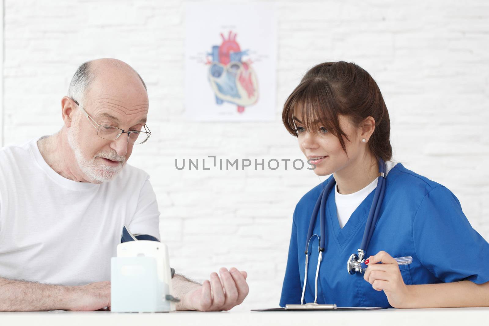 Doctor measuring blood pressure by ALotOfPeople